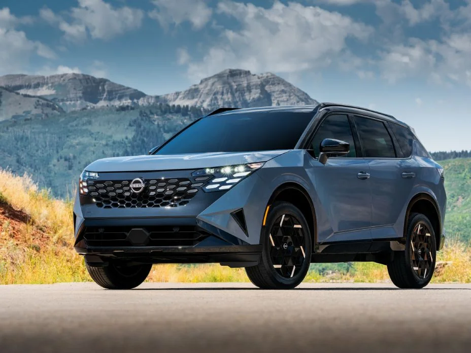 Gray 2027 Nissan Rogue Hybrid e-POWER on a mountain road